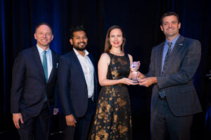 Amy Lamboley and Mashrur Mohiuddin accepting the Spark Award at the Wireless Hall of Fame dinner.